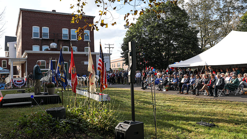 Speaker talking to a group of attendees at the Military & Veterans Campus groundbreaking event