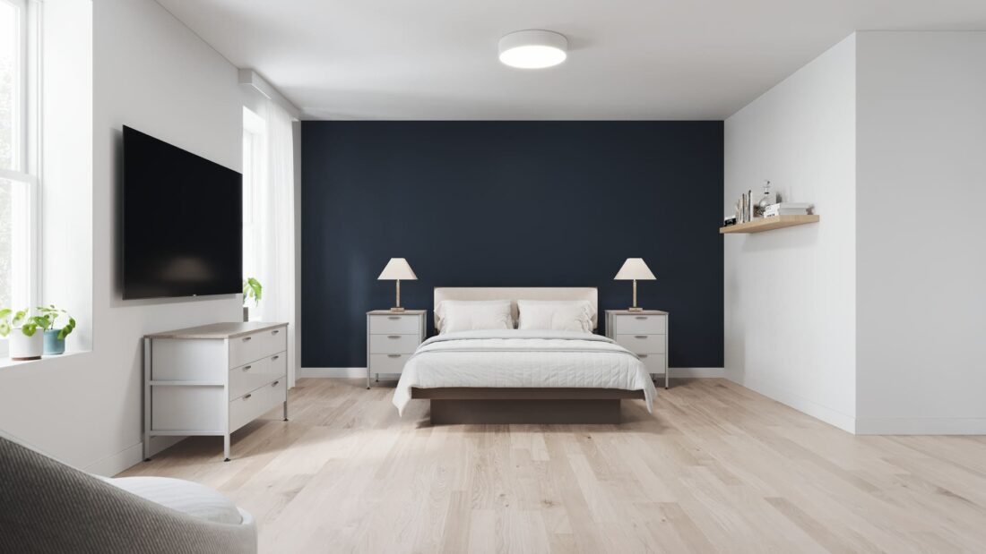 The King, featuring a luxurious king-sized bed, a modern sitting area, and a dedicated workspace.